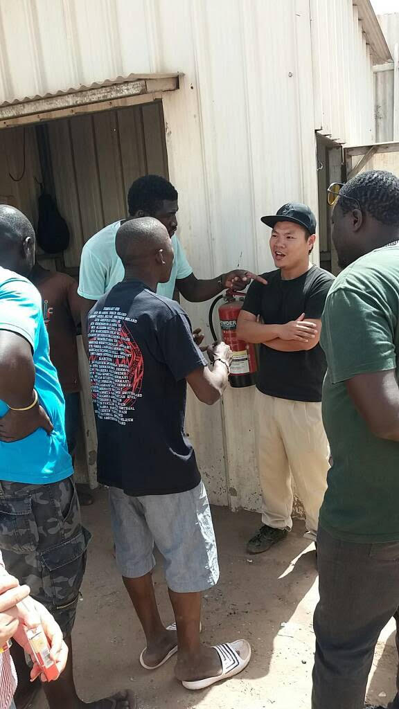 Local youths in argue with Golden Lead Factory owners, Gunjur, The Gambia